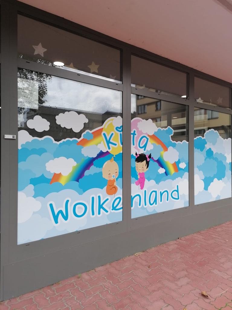 Colorful cloud-themed window mural